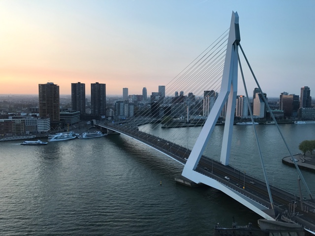 sunset from the Nhow hotel rotterdam over looking the city and Erasmusbrug bridge - First-Timers Guide for Visiting Rotterdam