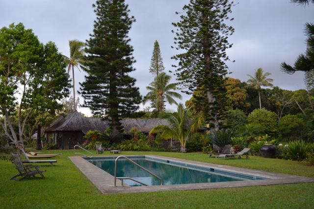 a view of the pool and main lodge at the pu'u o hoku ranch - Best Tips for Visiting Molokai, Hawaii