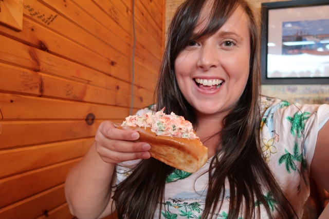 Cailin eating a lobster roll at Richards in PEI - Where to Eat the Best Lobster Rolls in Prince Edward Island?