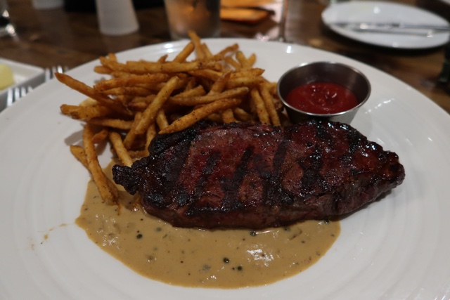 steak and frites for dinner at elliot's dining room at the white point beach resort